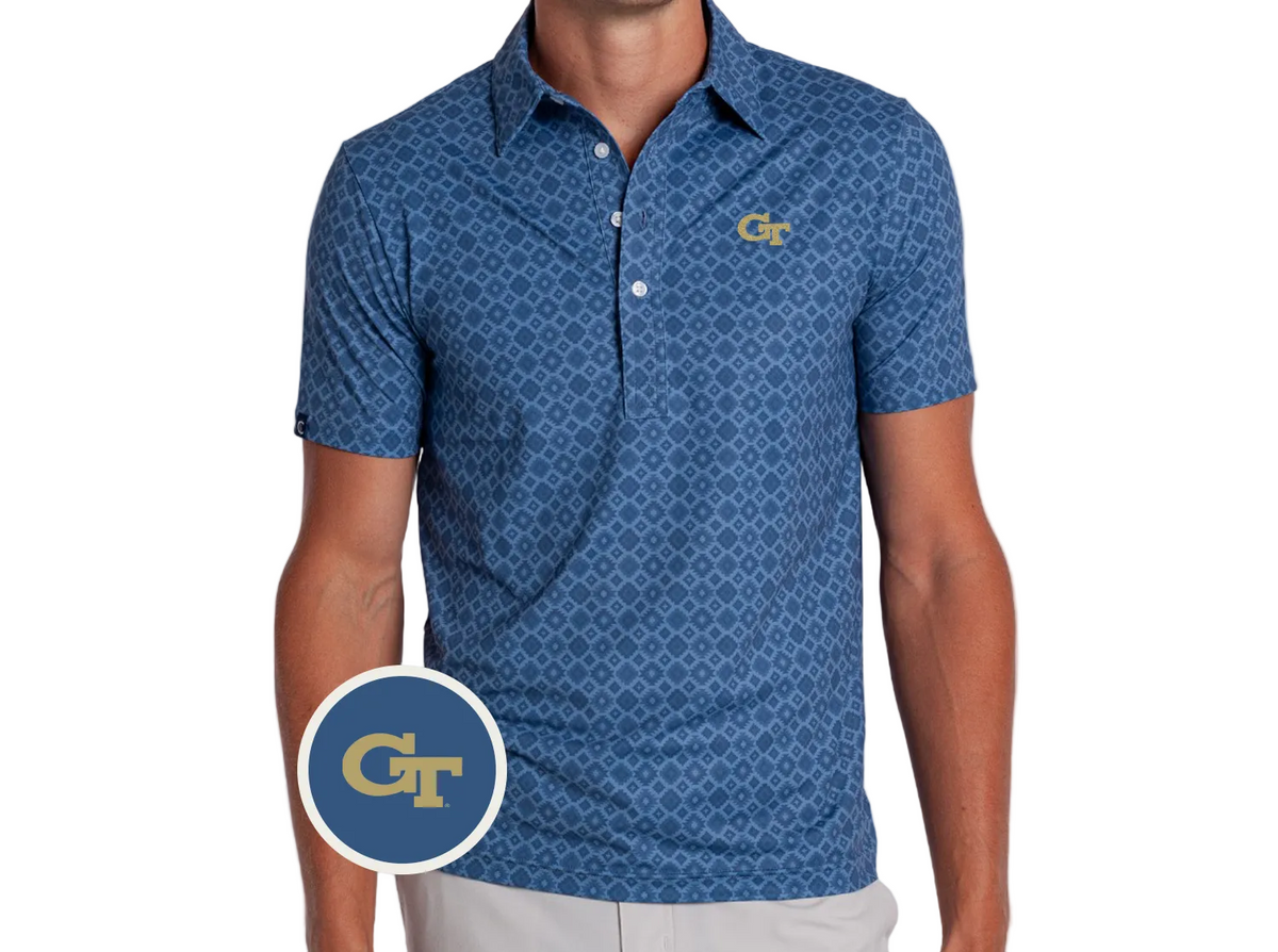 A man wearing a blue short-sleeve polo shirt with a repeating geometric pattern and a gold Georgia Tech GT logo on the left chest. A circular inset GT logo is shown in the lower-left corner.