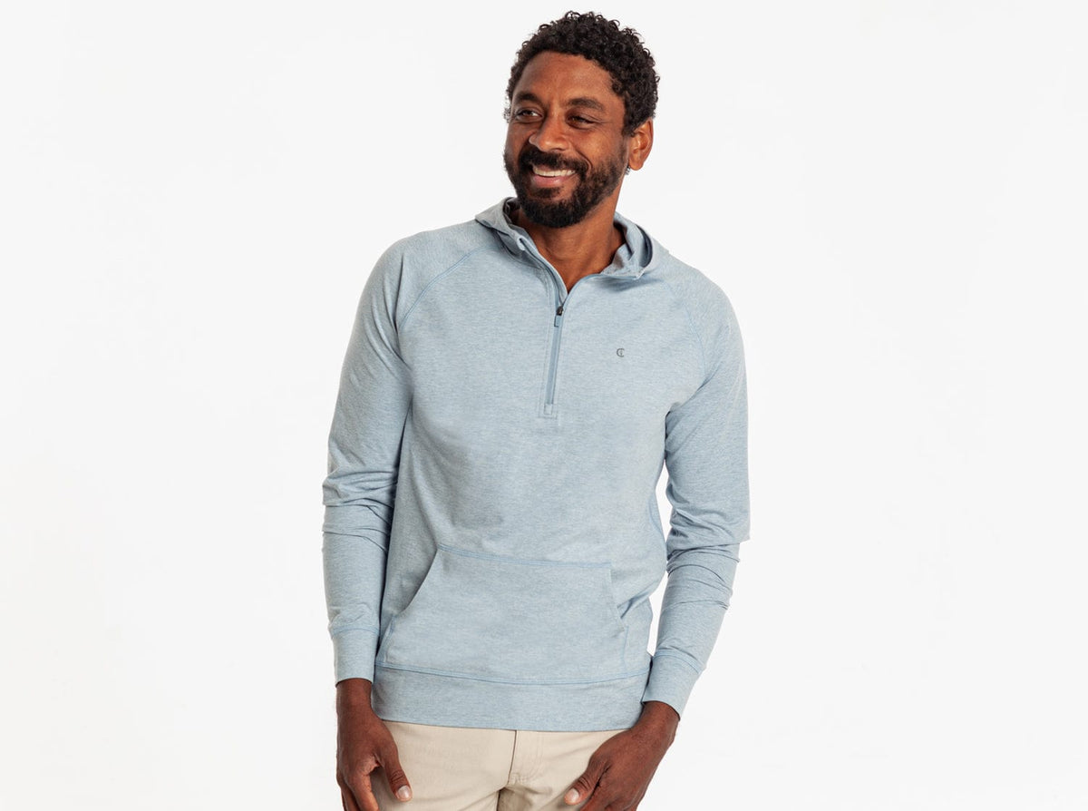 Criquet Ace Performance Hoodie in Dusty Blue, studio photo