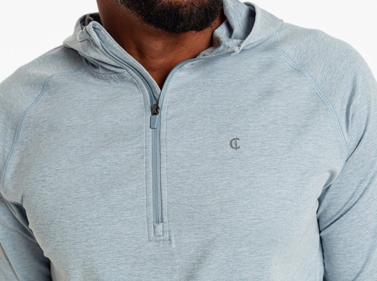 Criquet Ace Performance Hoodie in Dusty Blue, studio photo