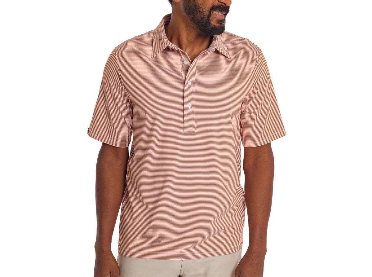 Criquet Performance Sport Range Polo in Hobby Stripe, Burnt Orange, studio photo