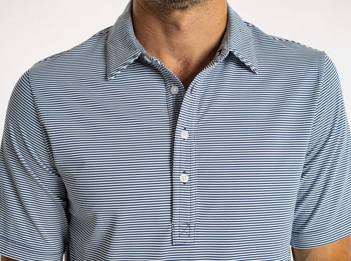 Criquet Performance Sport Range Polo in Hobby Stripe, Navy, studio photo