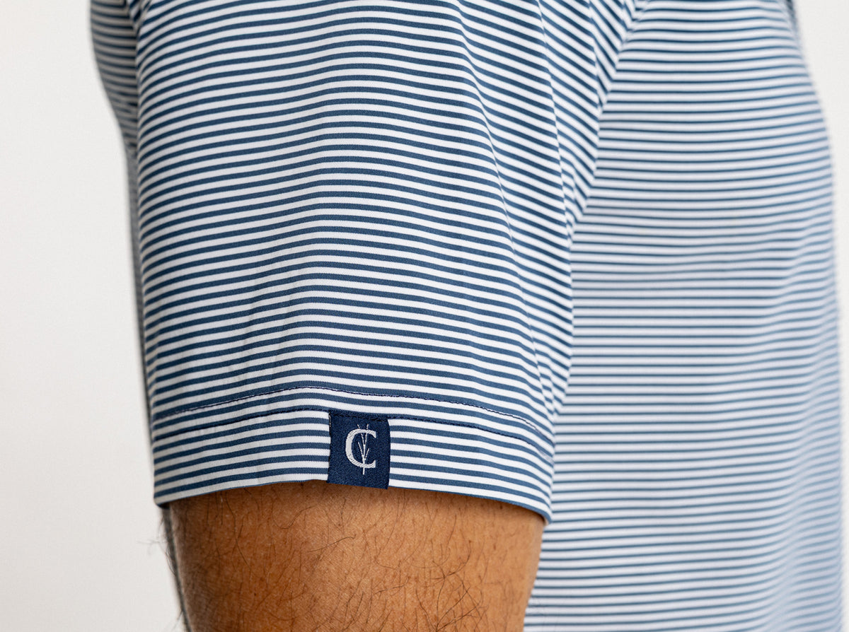Criquet Performance Sport Range Polo in Hobby Stripe, Navy, studio photo