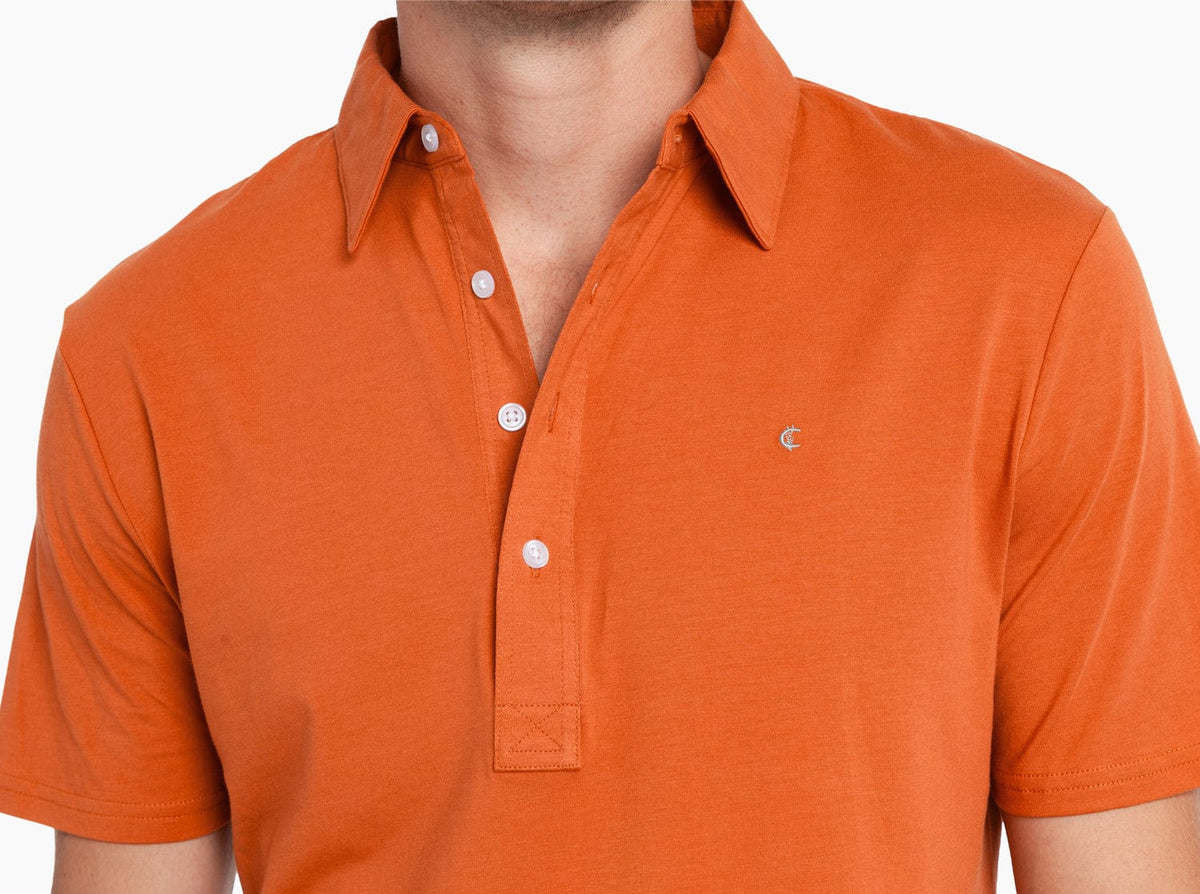 Criquet Slim Fit Top-Shelf Range Polo in Burnt Orange, studio photo